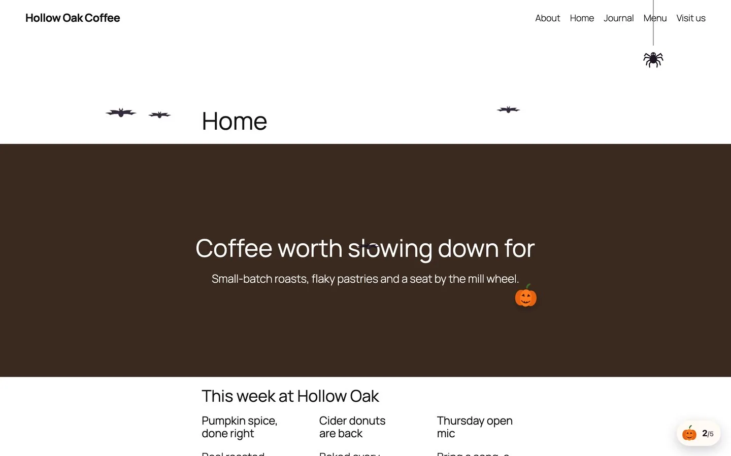 Demo café site with a hidden pumpkin, flying bats, a dangling spider and the progress counter